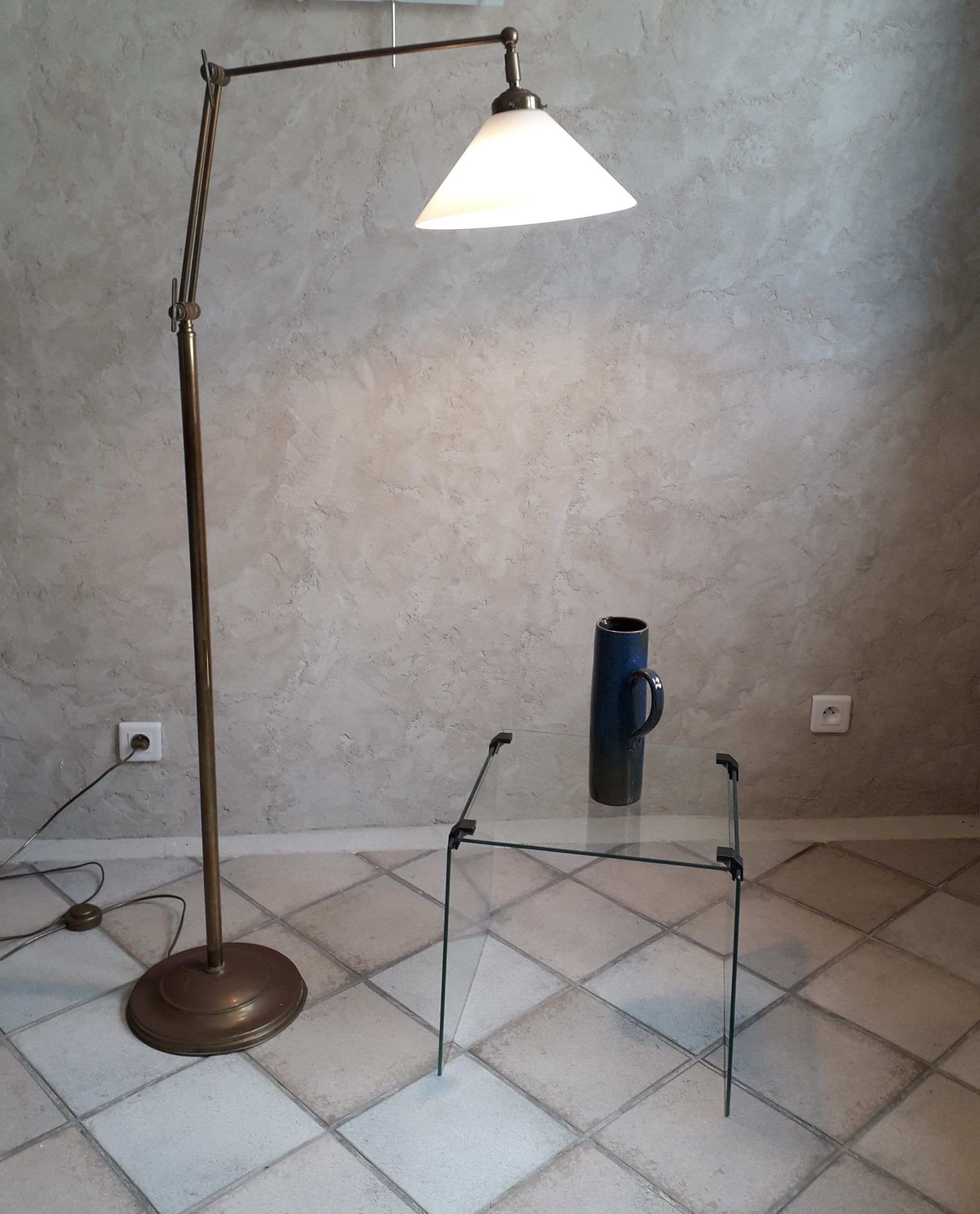 Articulated brass floor lamp