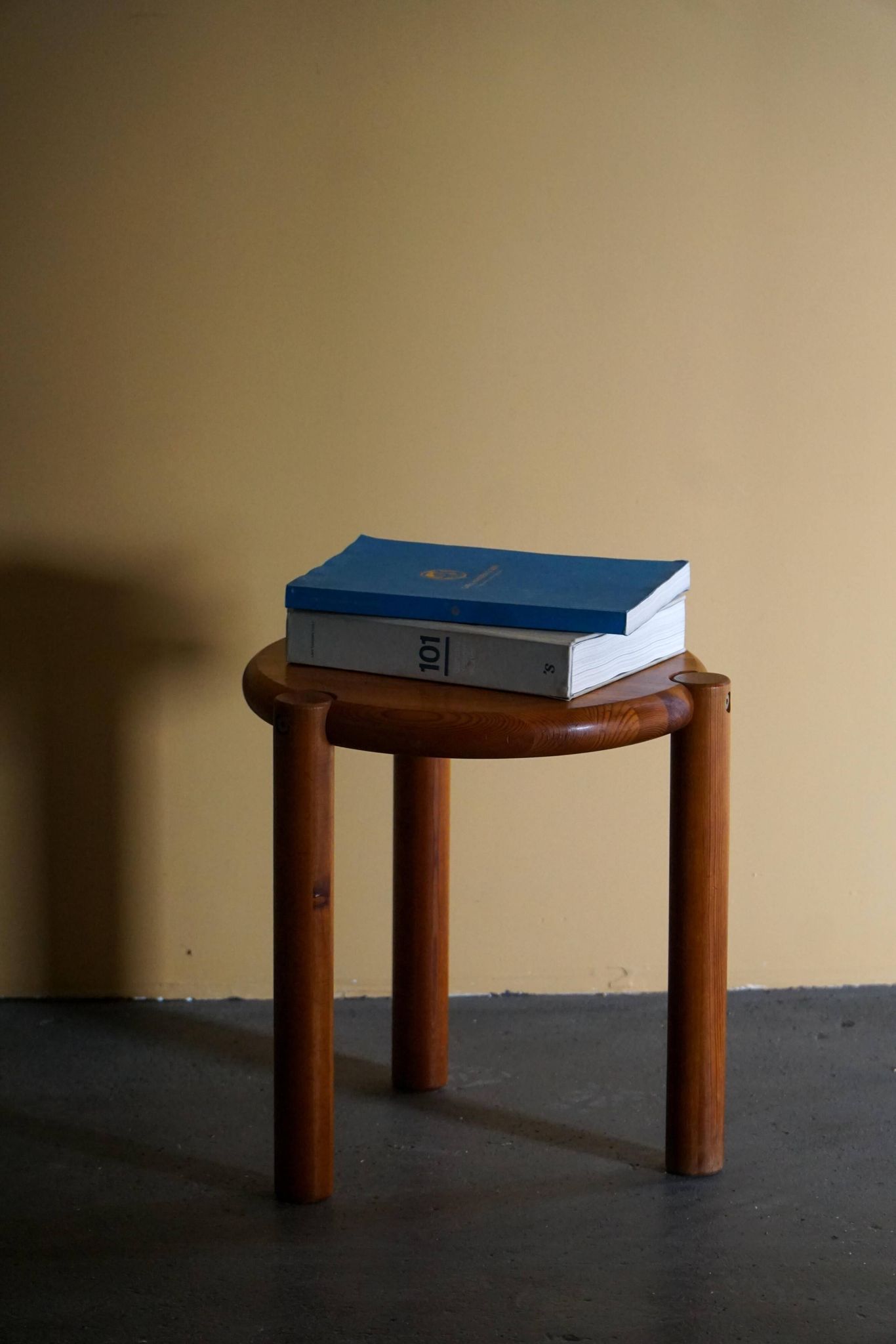 Modern Scandinavian tripod stool from the 20th century with a circular seat, 1970s.