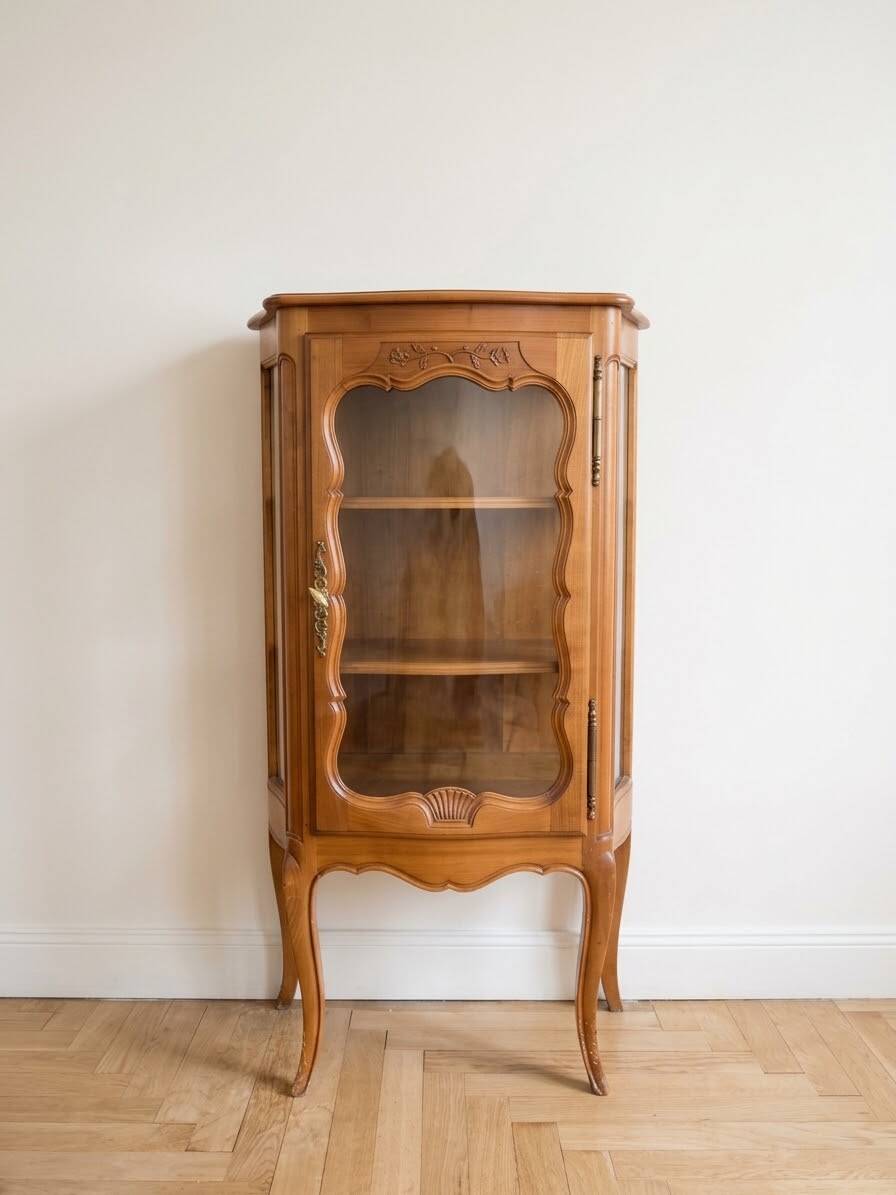 Small silver display cabinet in Louis XV style made of wood.