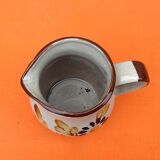 Glazed ceramic pitcher floral decoration