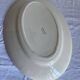 Oval dish with green motorcycles Terre de Fer