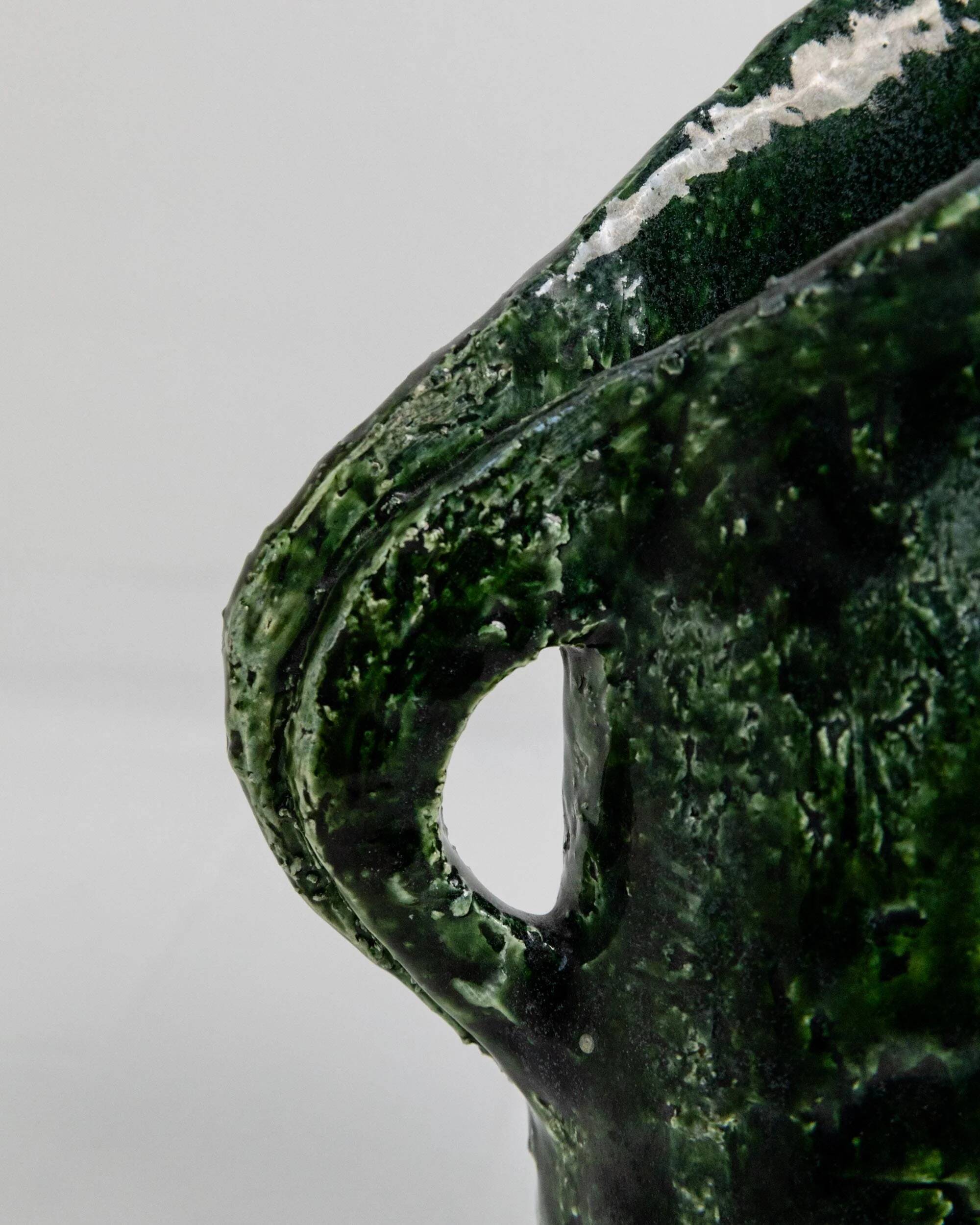 Vintage 1970s studio ceramic vase or pitcher, glazed green.