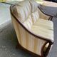 Two-seater Louis XVI canapé in golden beige fabric and curved solid wood.