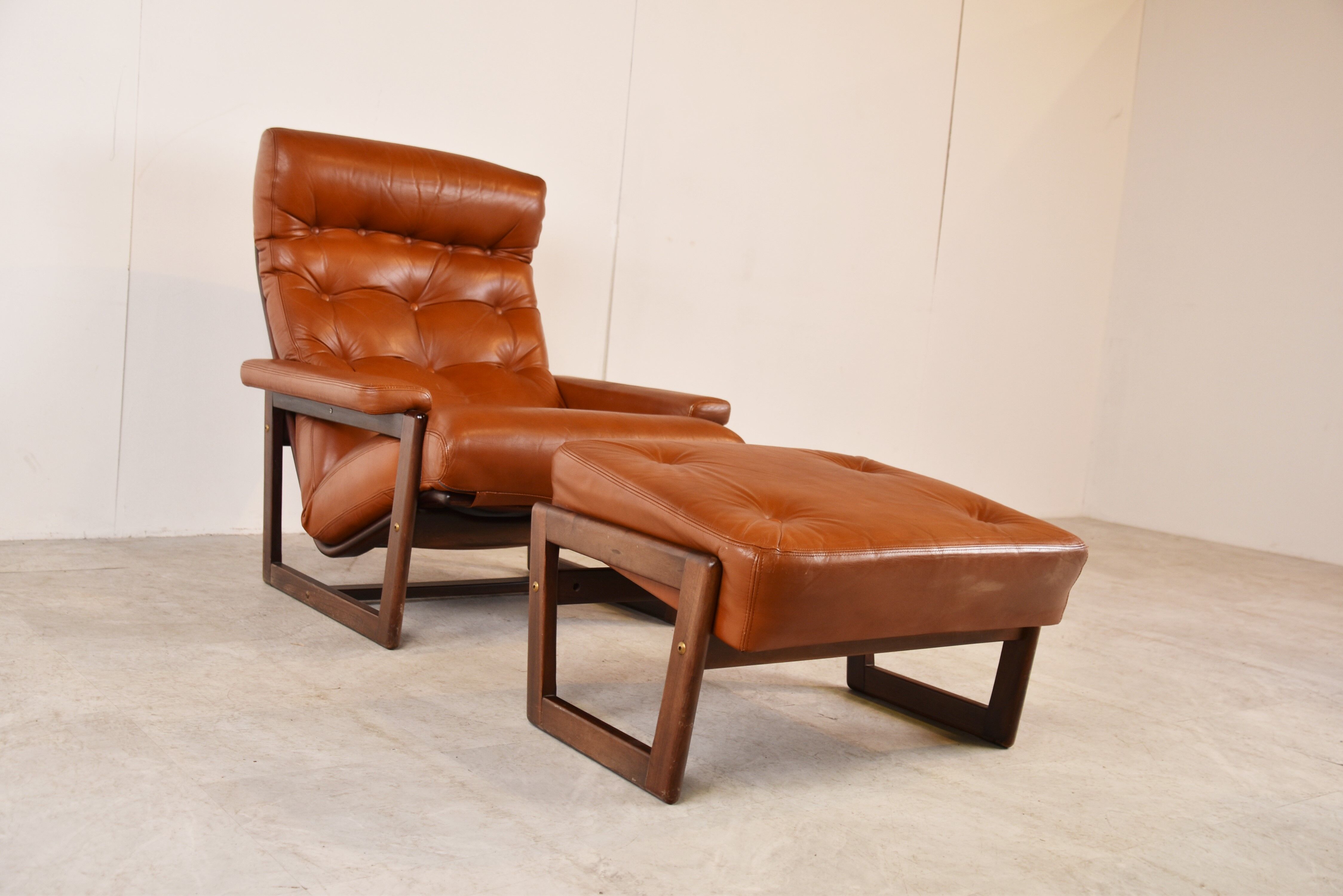 Vintage leather armchair with hocker, 1970s