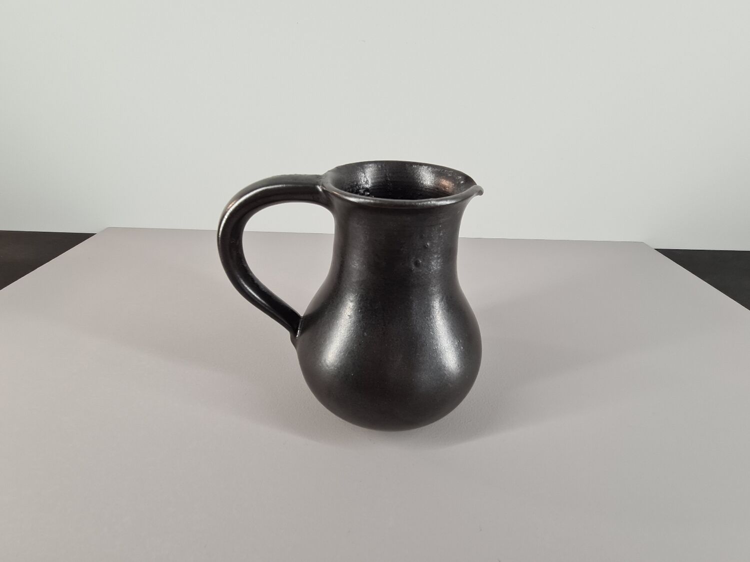 Modernist pitcher in black ceramic 50s