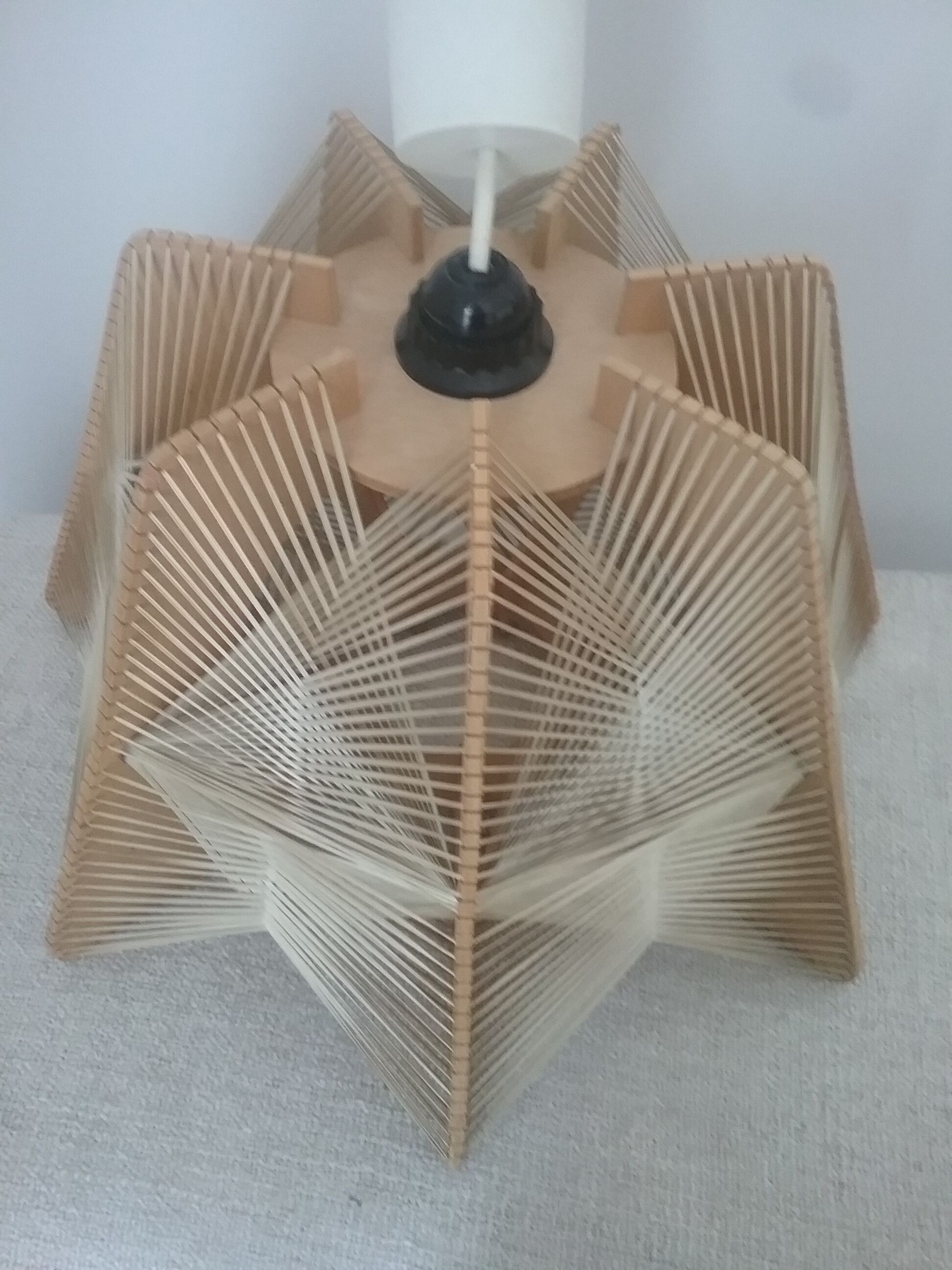 Hanging lamp of wood and thread Scandinavian style