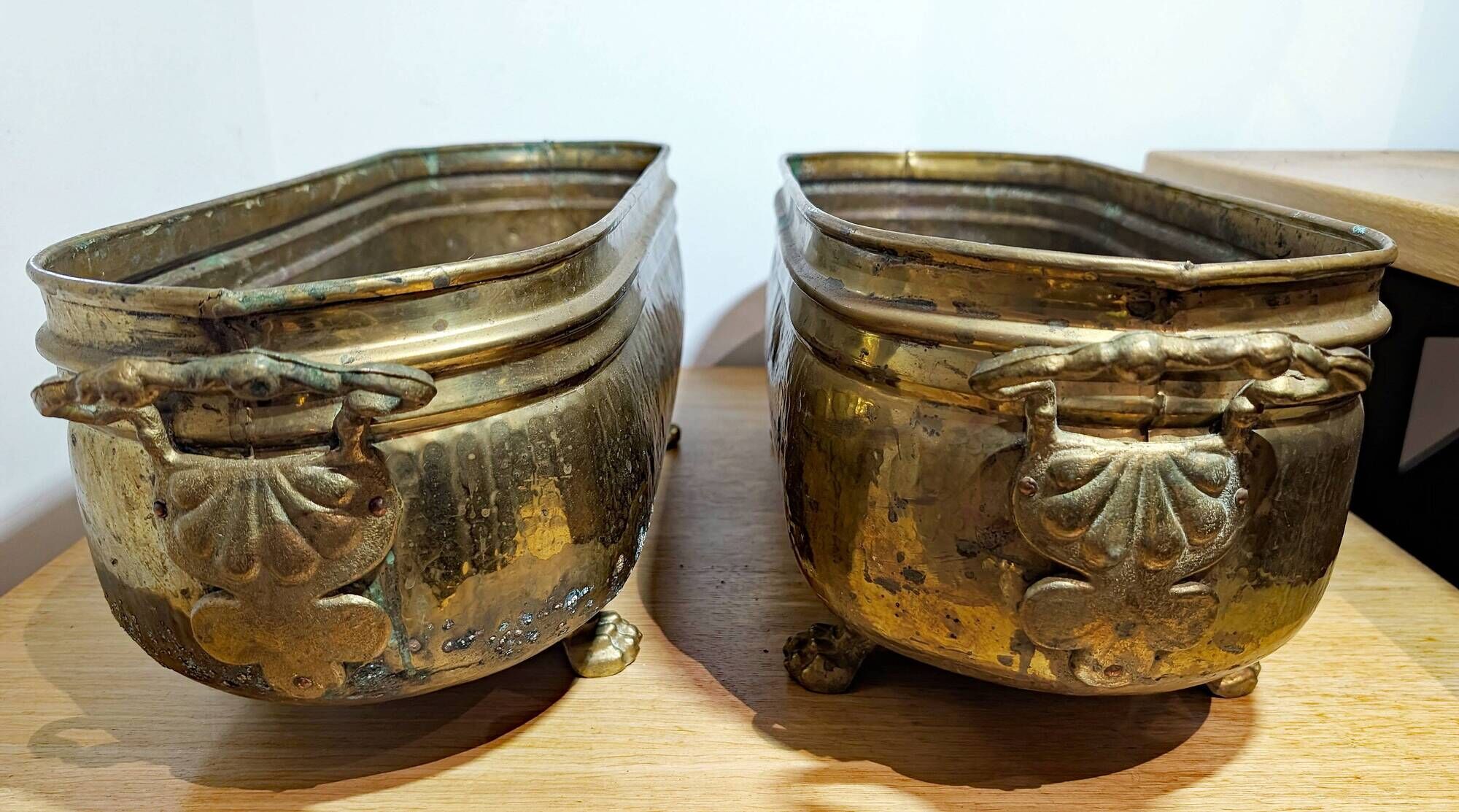 Pair of large antique planters with lion's paw feet.