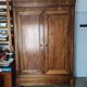 Old walnut wood cabinet with hat and 2 drawer doors