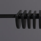 Floor lamp made from black painted metal with balancing arm