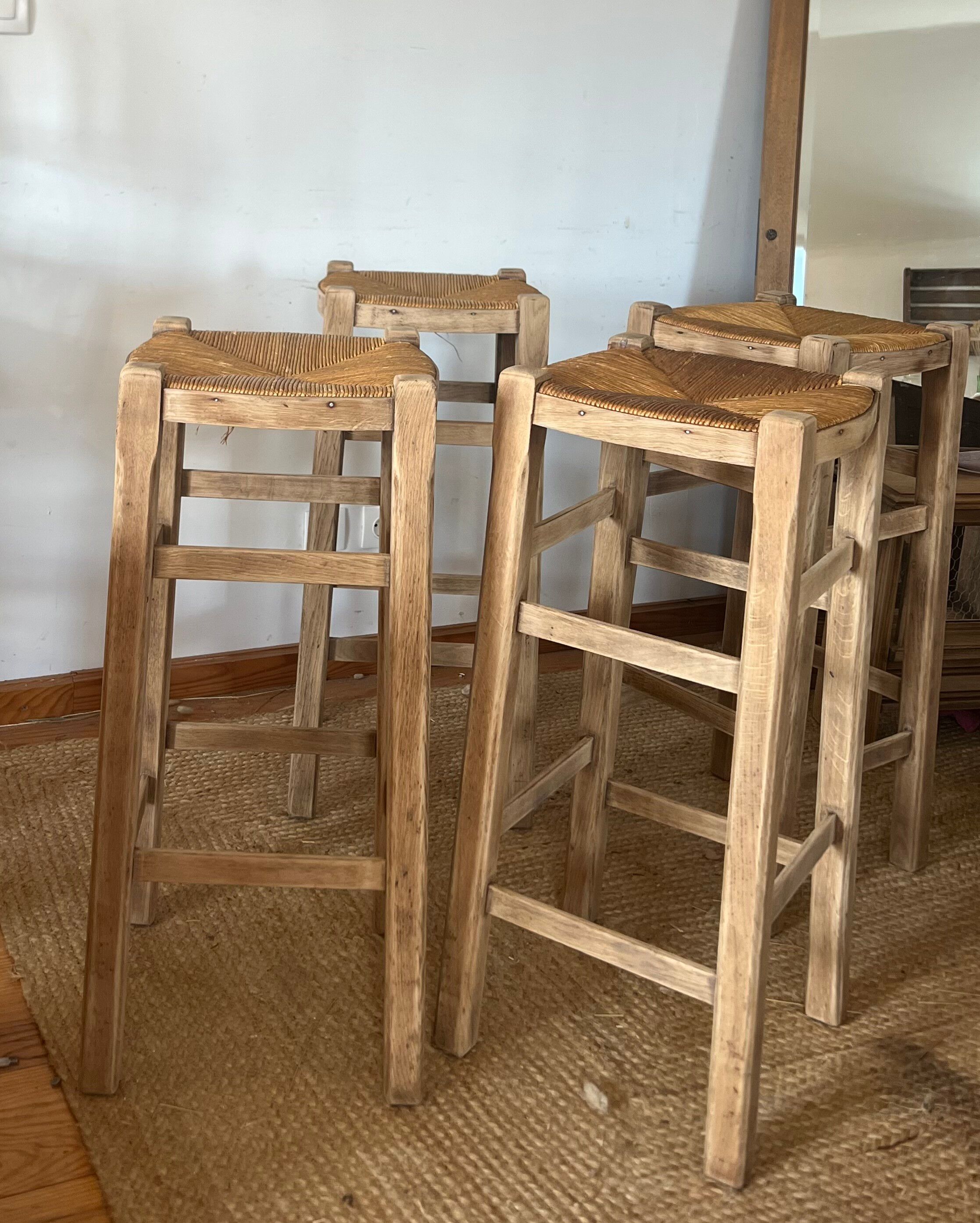 Set of 4 vintage high bar stools in raw solid oak and straw.