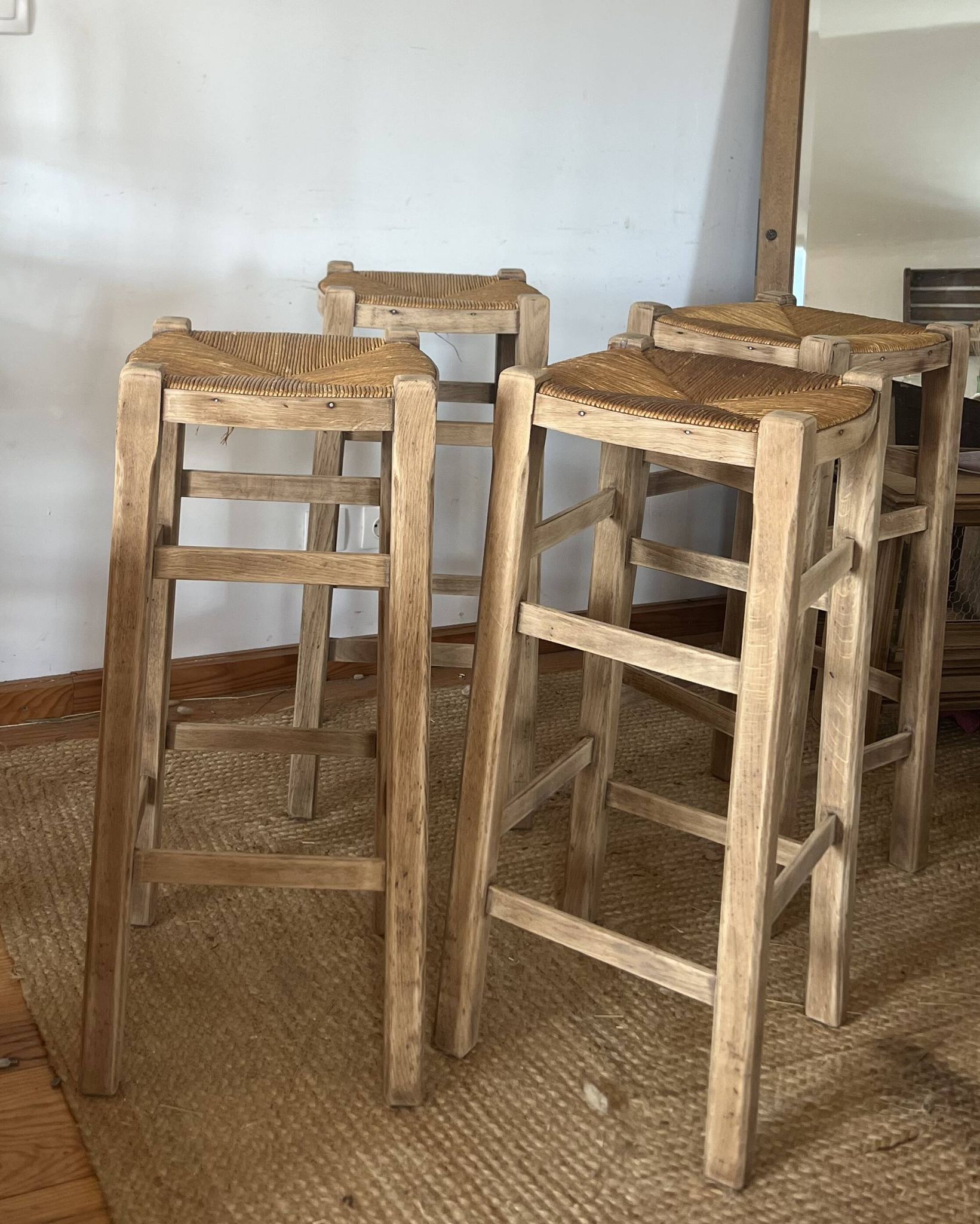 Set of 4 vintage high bar stools in raw solid oak and straw.