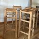 Set of 4 vintage high bar stools in raw solid oak and straw.