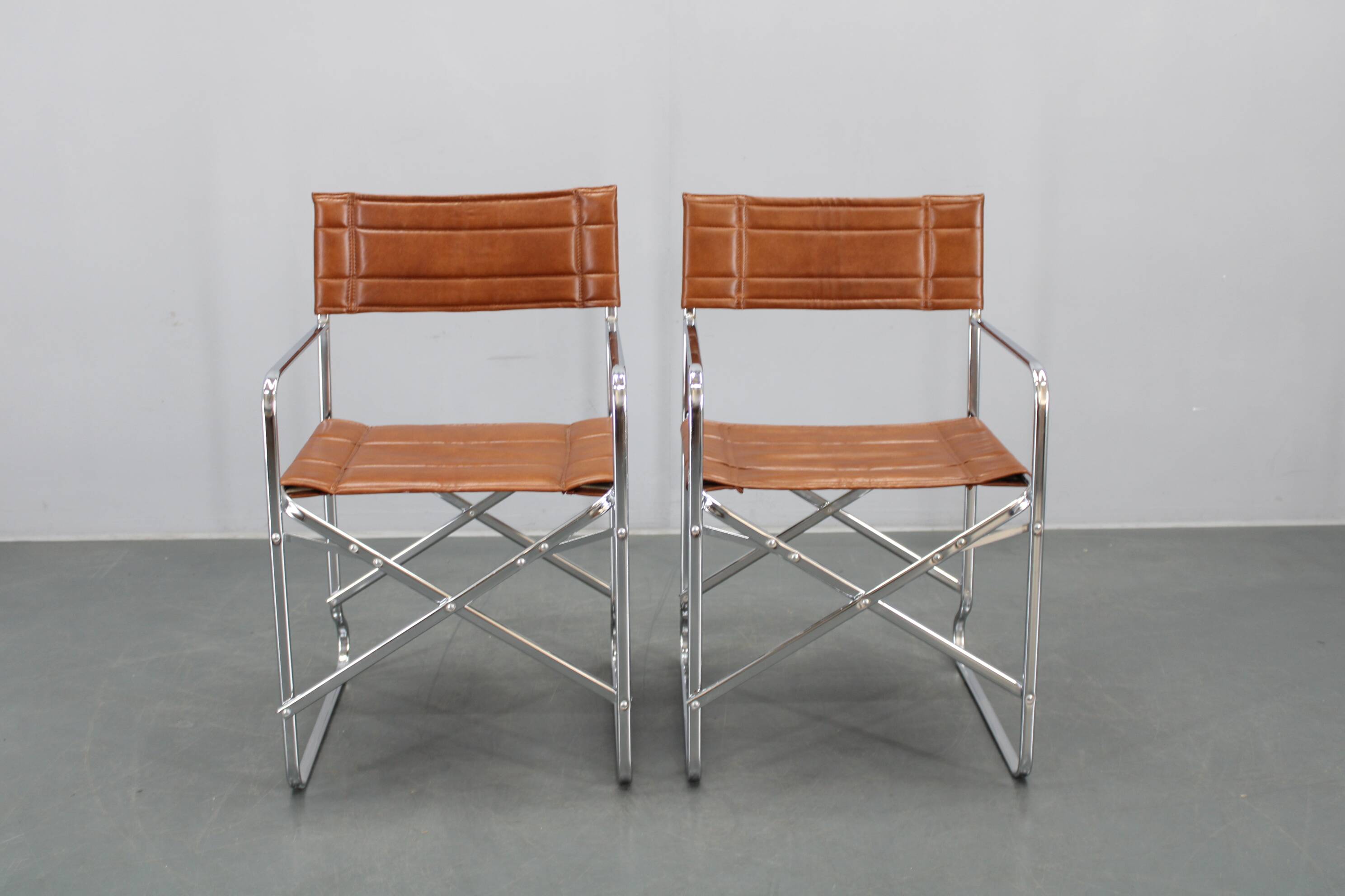 1970s pair of Italian folding chairs with leatherette upholstery