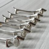 Metal dachshund dog knife holder.