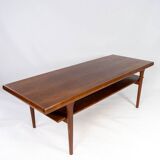 Coffee table with shelf in teak of danish design from the 1960s.
