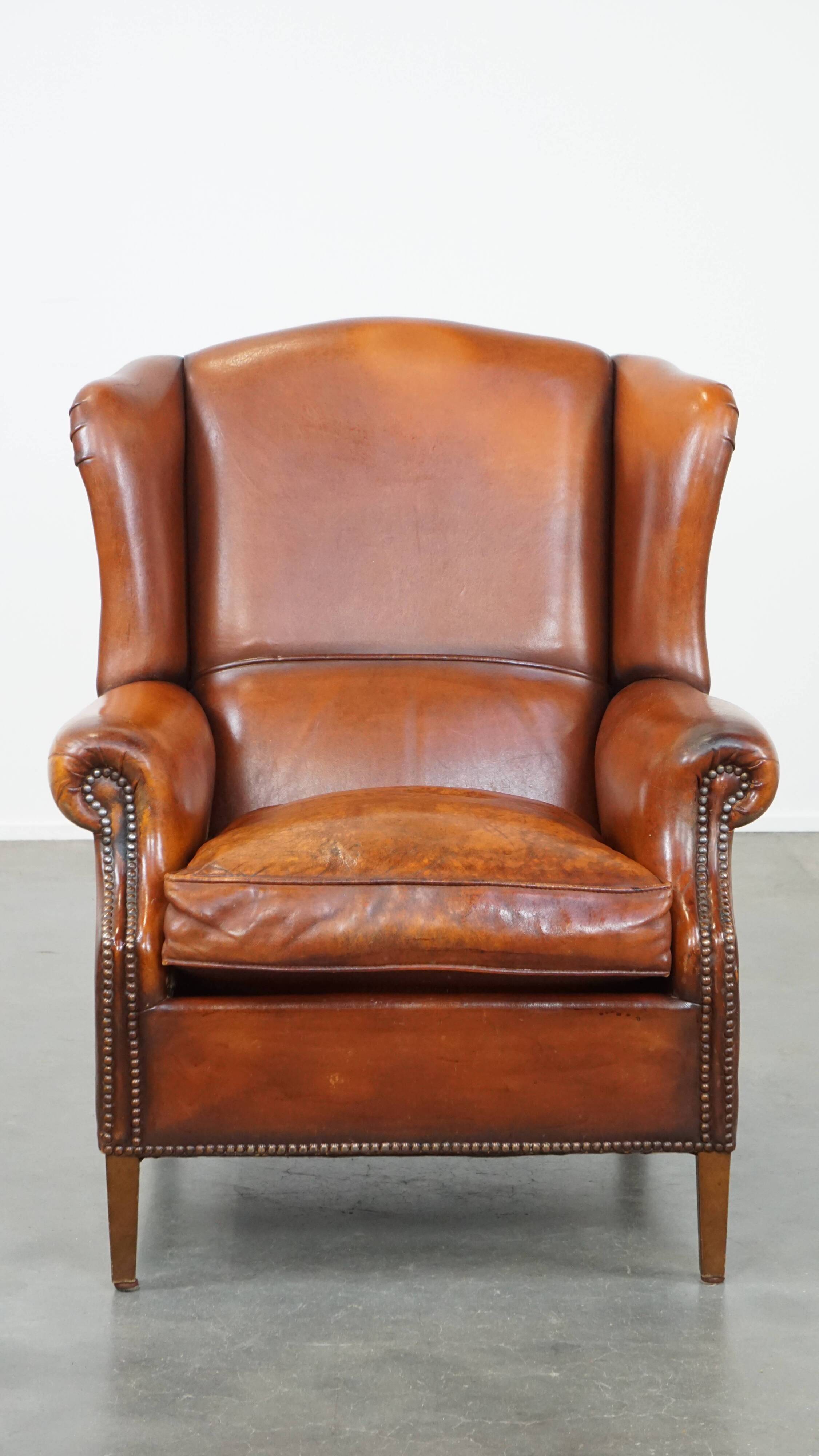 Sheepskin leather wingback chair with patina