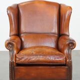 Sheepskin leather wingback chair with patina