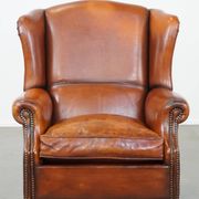 Sheepskin leather wingback chair with patina