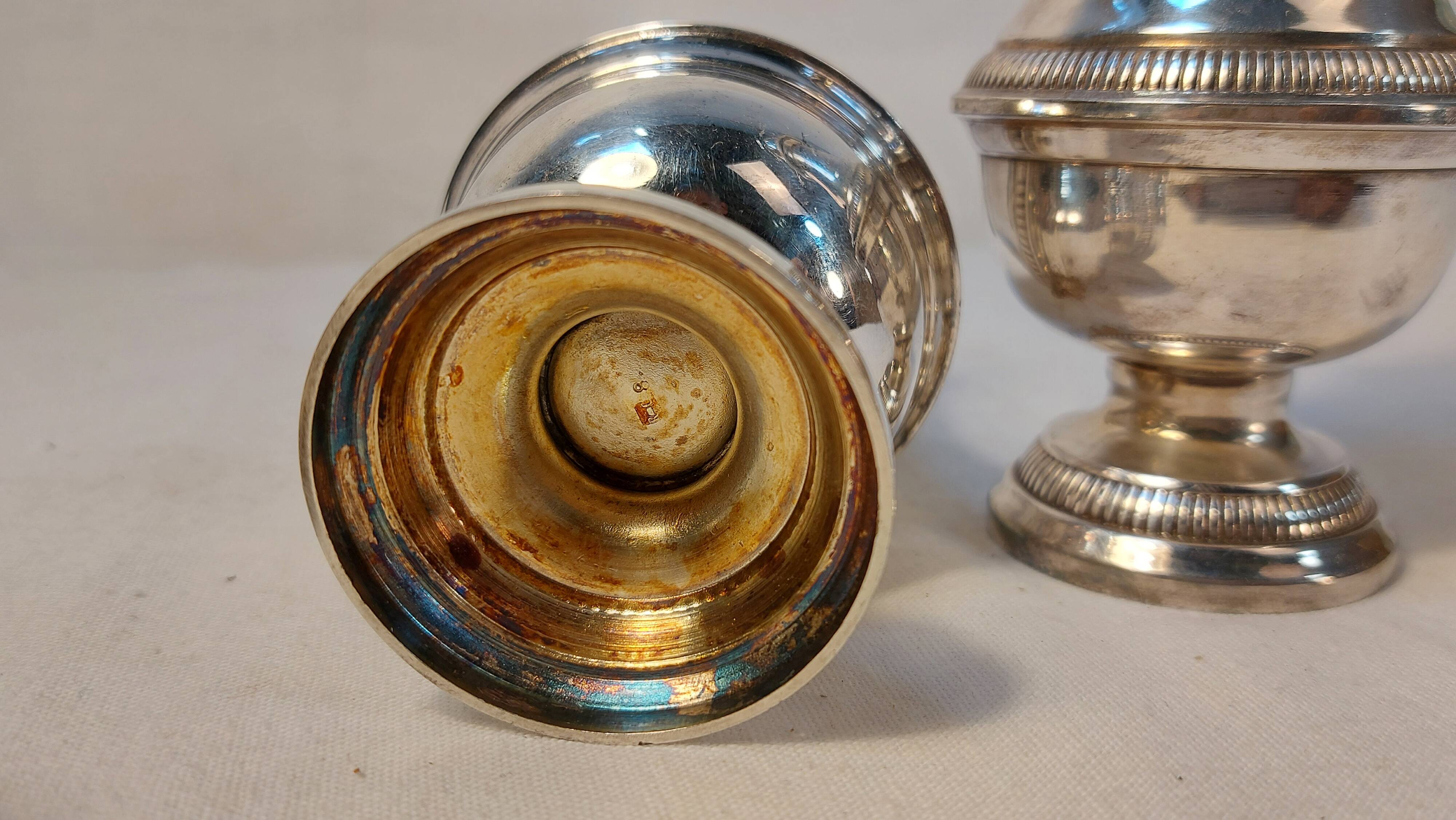 Set of two silver metal sprinklers