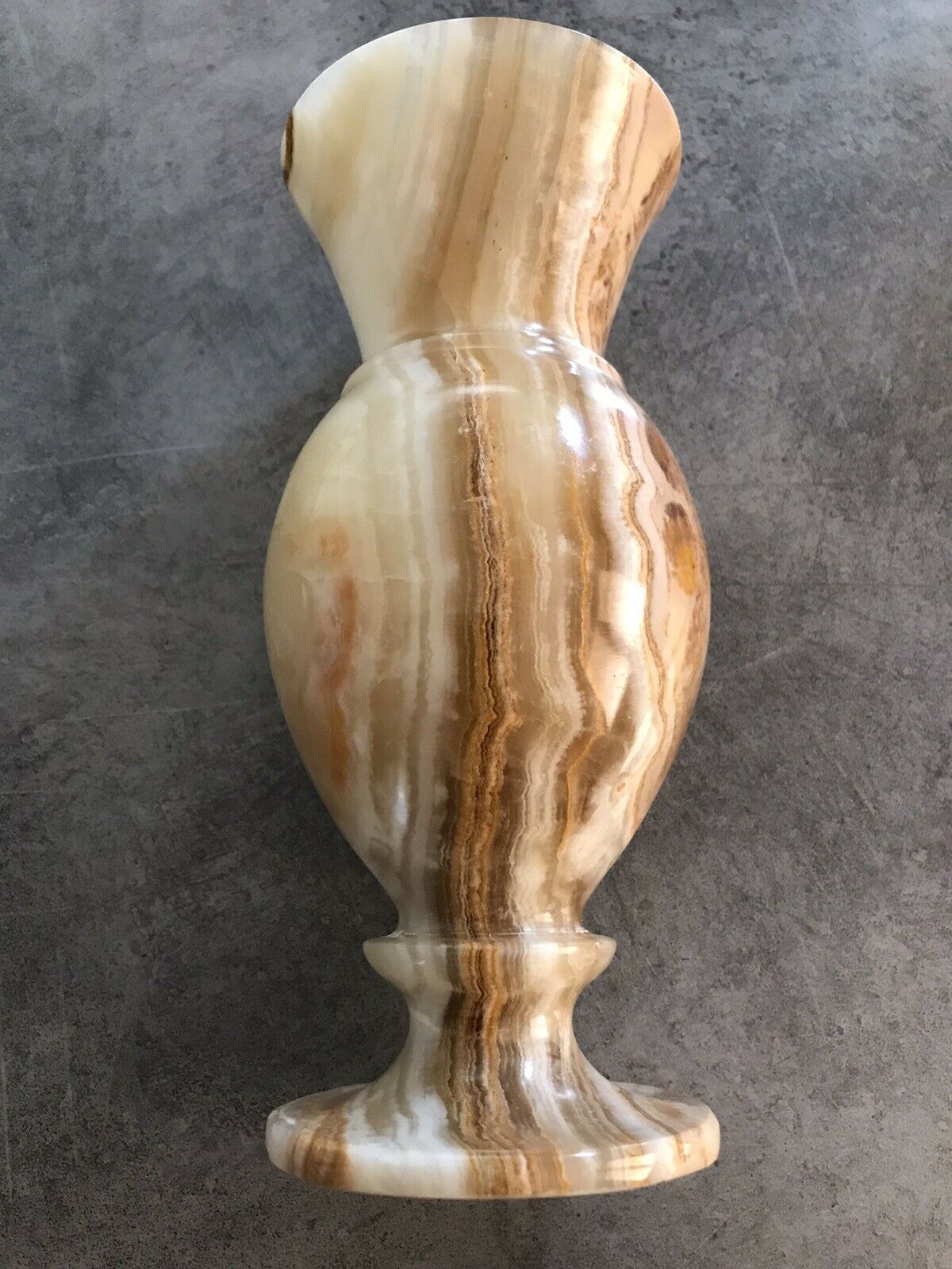 Vintage vase in marbled onyx stone shades of beige and brown