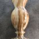 Vintage vase in marbled onyx stone shades of beige and brown