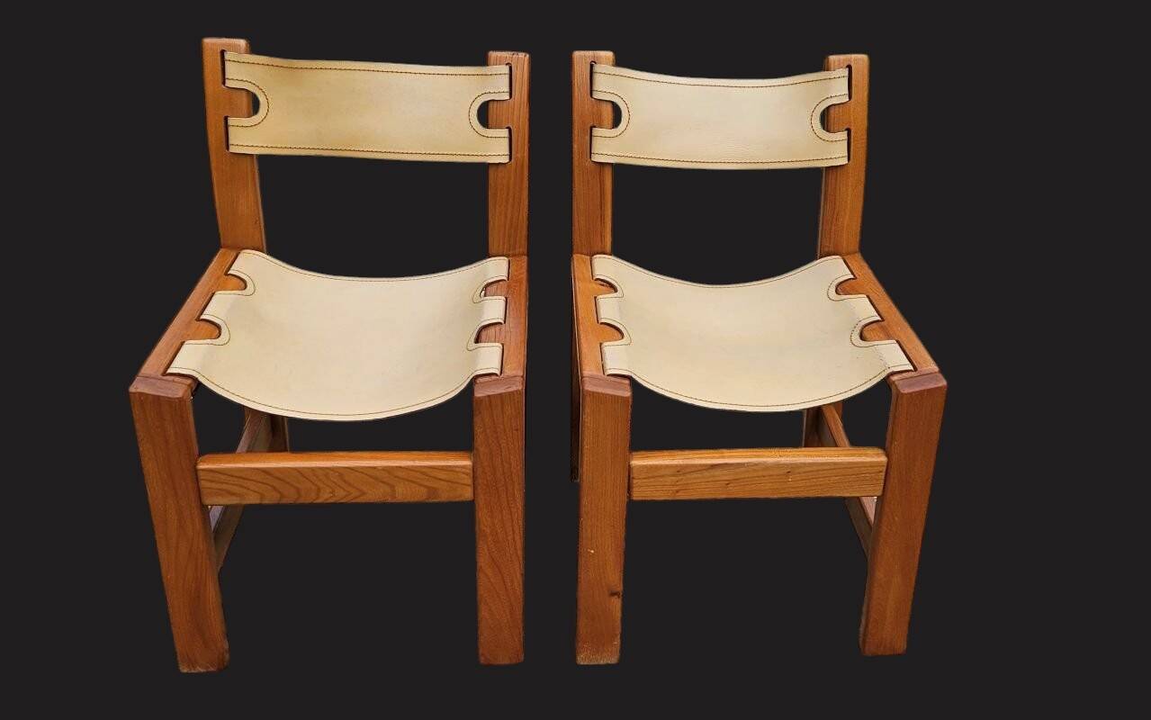 Pair of elm and leather chairs by Maison Regain