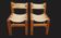 Pair of elm and leather chairs by Maison Regain