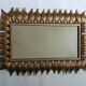 Vintage gold metal mirror with leaves from the 1950s.