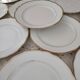 Lot de 11 assiettes à dessert en porcelaine suisse blanche double liseré doré