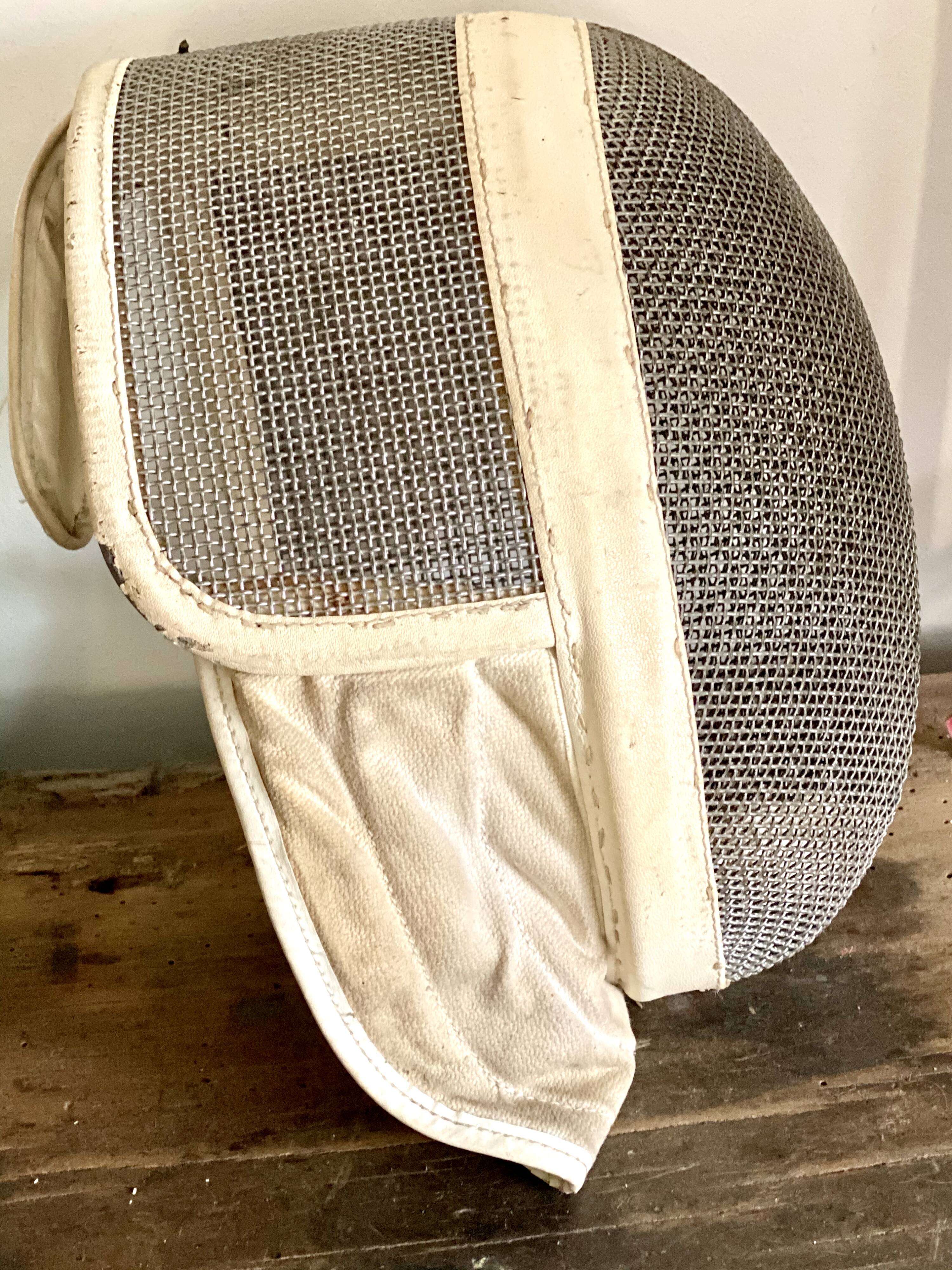 Old fencing mask set and its foil
