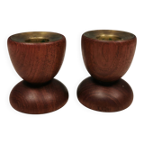 Two beautiful teak candle holders with brass inserts.