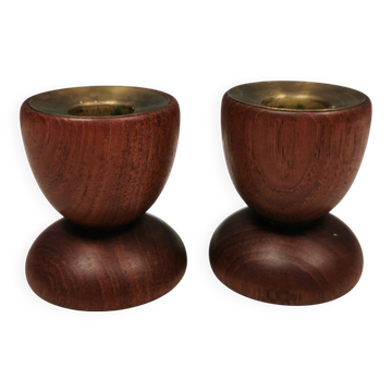 Two beautiful teak candle holders with brass inserts.