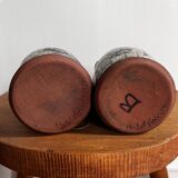 Vintage terracotta mugs with glazed designs and flower/fish motifs