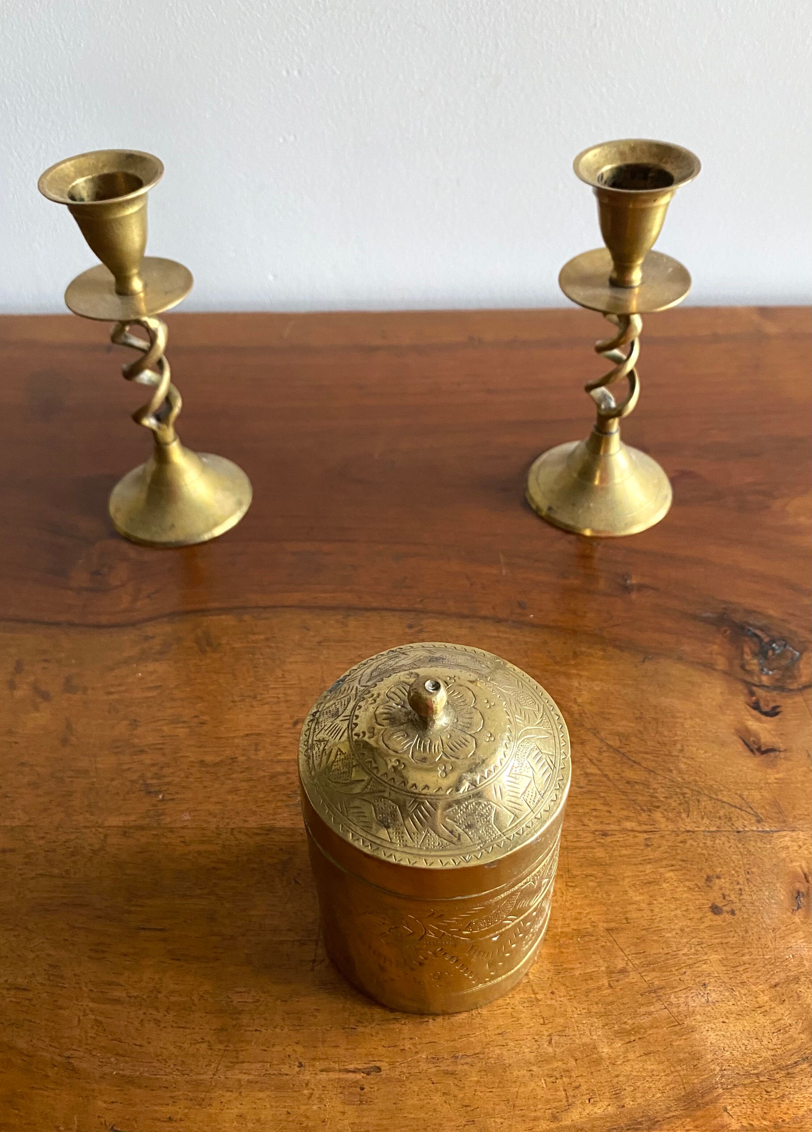 Old round box in chiseled brass