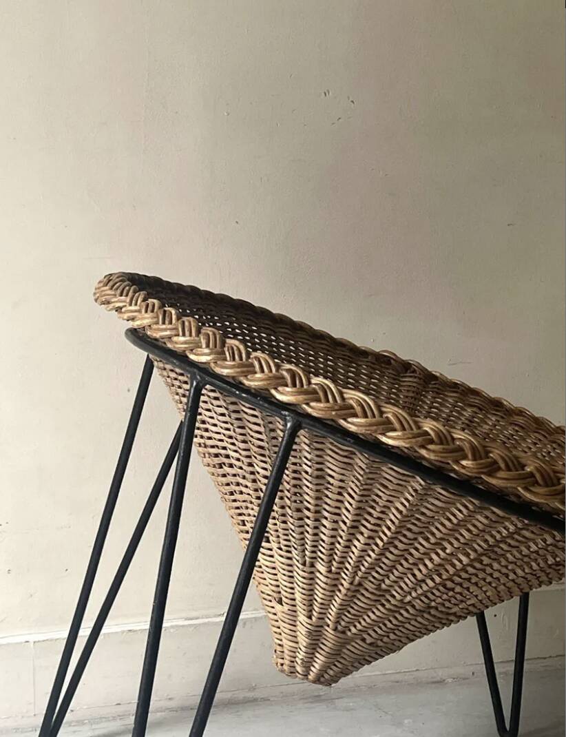 Italian basket chair in rattan and black metal, 1950s design.