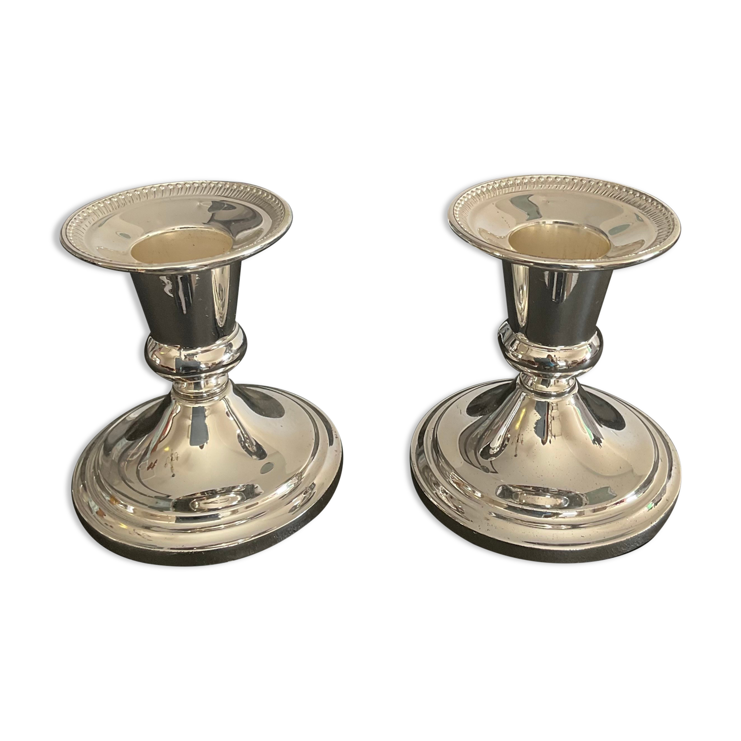 Pair of vintage candle holders in silver metal