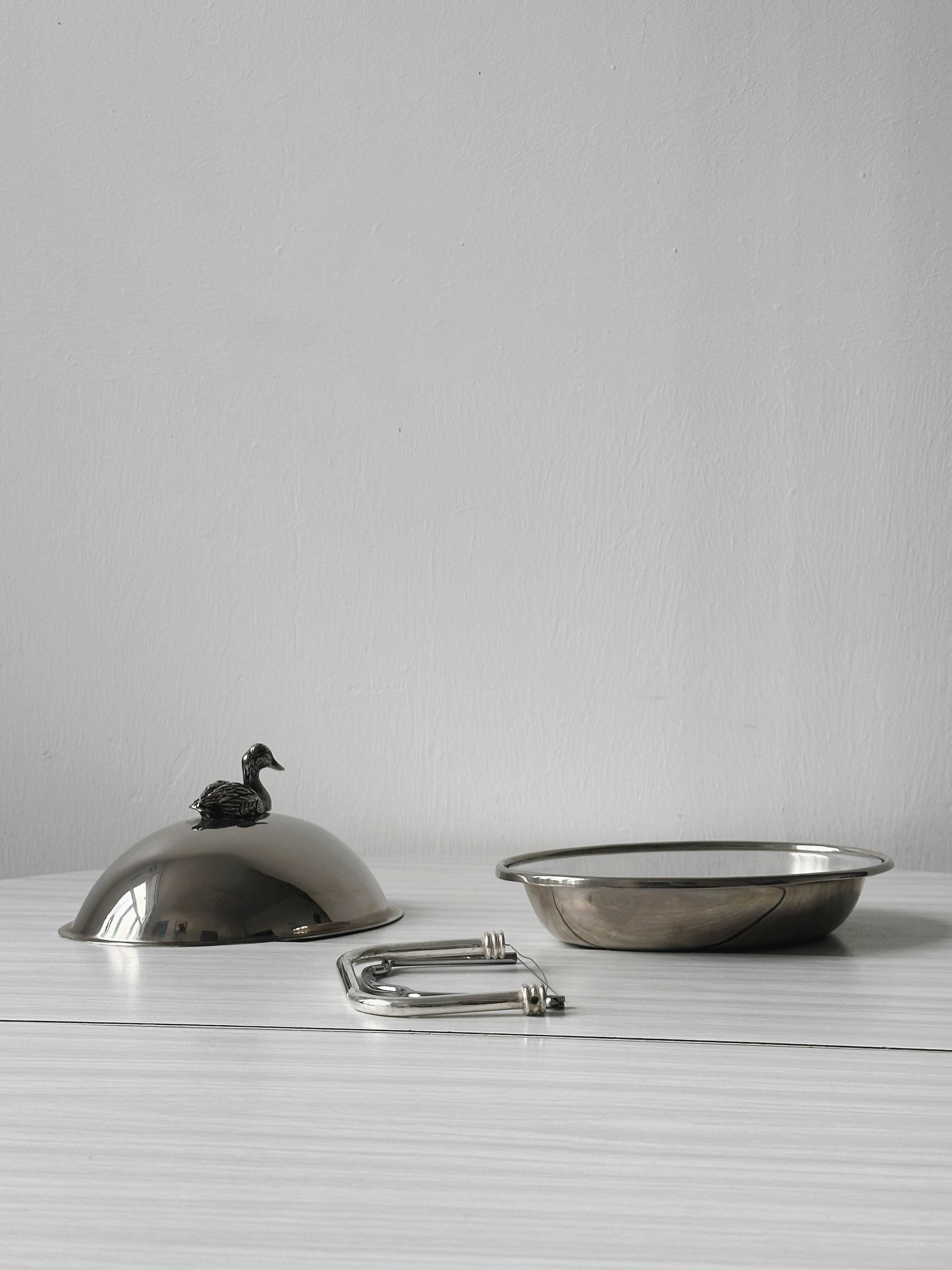 Foie gras display in stainless steel and silver metal.