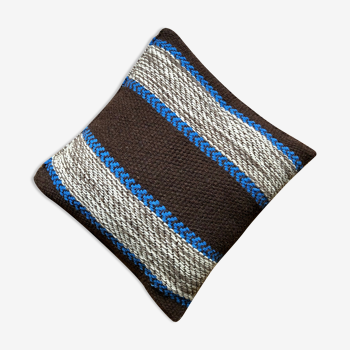 Beige and blue wool cushion