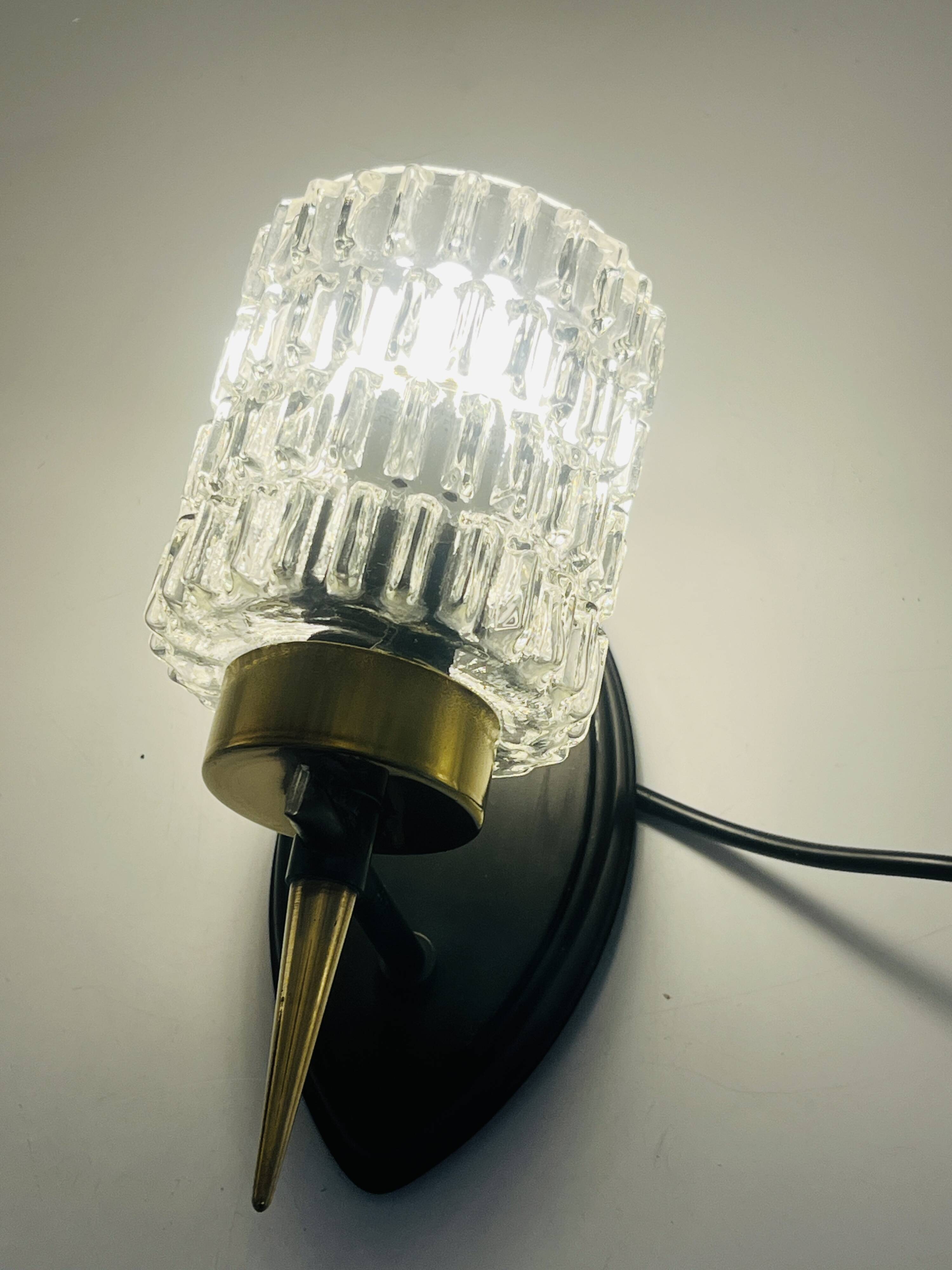 Pair of vintage wall lights with textured glass, attributed to Maison Arlus.