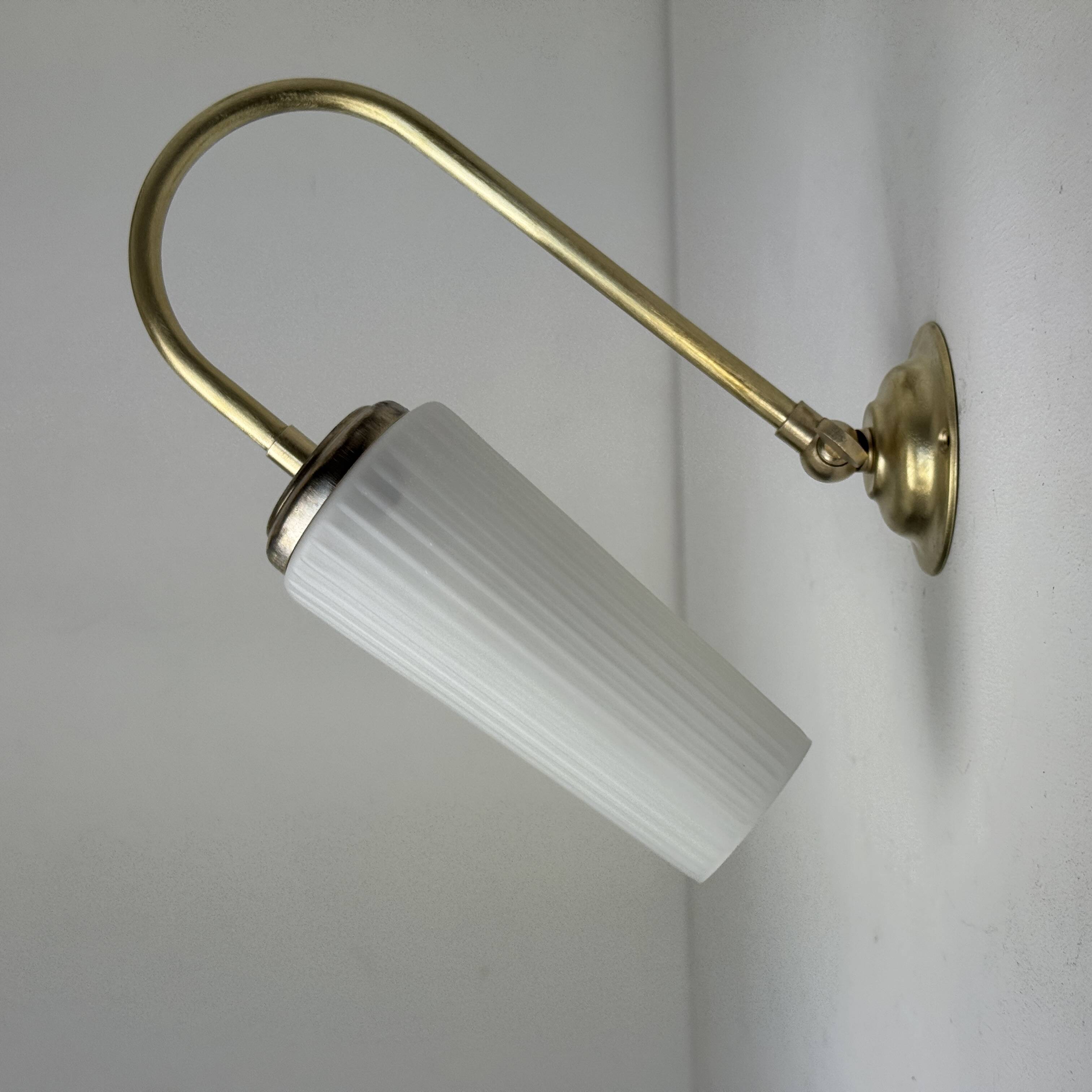 A pair of vintage opaline and brass wall lights