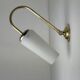 A pair of vintage opaline and brass wall lights