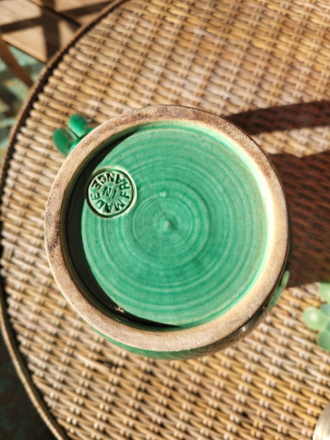 Green glazed ceramic pitcher