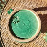 Green glazed ceramic pitcher