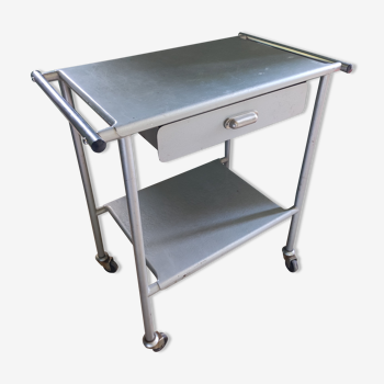 Serving table with metal wheels of dentist