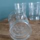Old digestif or liqueur glasses, handcrafted glass with a floral pattern.