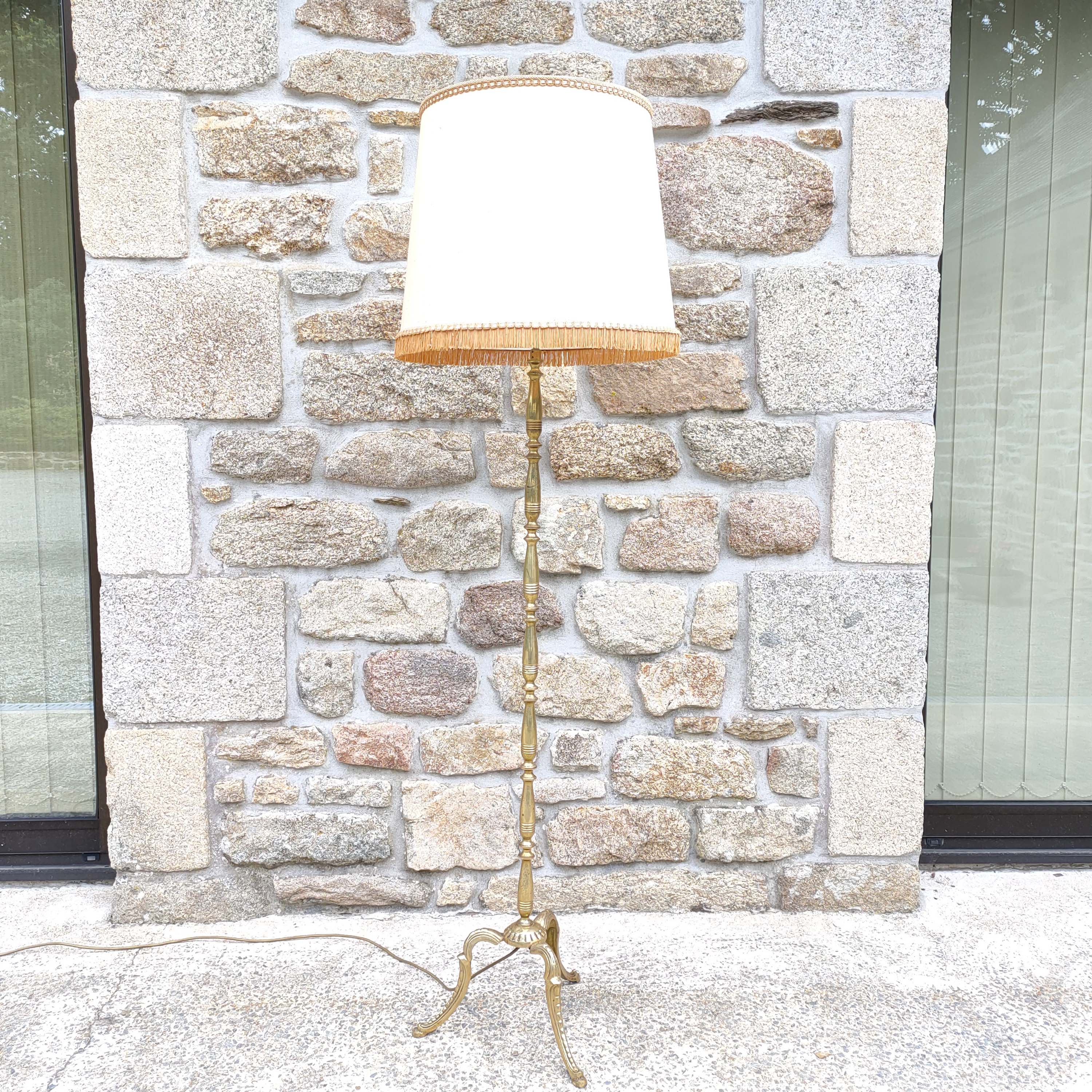 Tripod golden floor lamp