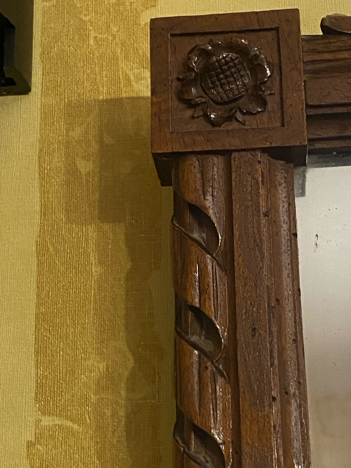 Carved wooden mirror in Louis XVI style