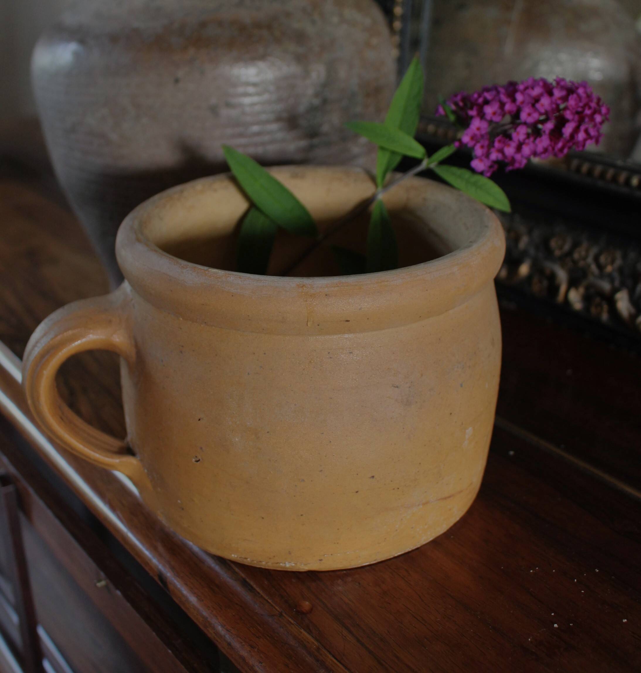 Round terracotta milk jug with handle