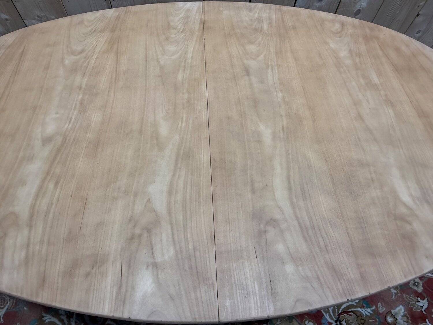 Oval Louis XVI dining table in cherry wood.