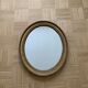 Old oval golden mirror